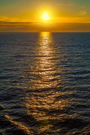Sunset over sea, vertical wallpaper for mobile devicesの写真素材