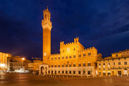 Campo Square with City Hall in Siena at night, Italyの写真素材