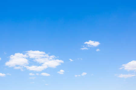 Blue sky with rare clouds. Background with large copy spaceの写真素材