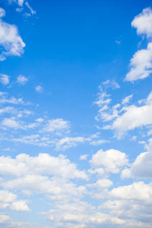 White clouds in the blue sky. Vertical backgroundの写真素材