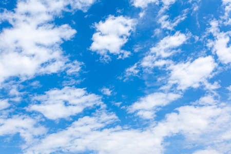 Fast moving clouds in the blue sky, may be used as backgroundの写真素材