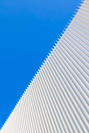 Abstract architectural background with wall and blue skyの写真素材