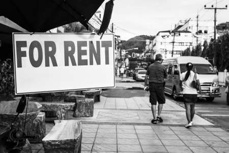 For Rent sign in the street, Thailand. Black and white urban photography, shallow DOF, focus on the signboardの写真素材