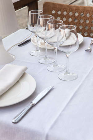 Fine table setting at restaurant ready to serve. Shallow DOF!の写真素材