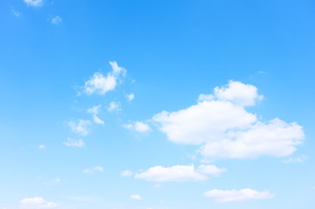 Blue sky with rare white clouds - background with copy spaceの写真素材