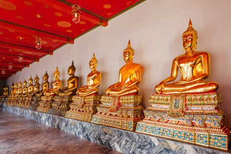 Gilded statues of the Buddha in a temple in Bangkok, Thailandの写真素材