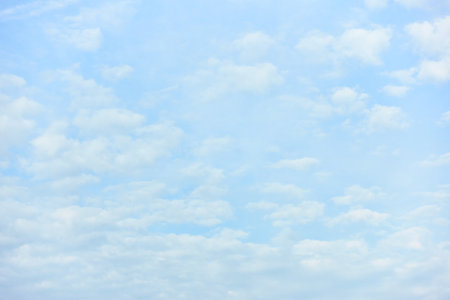 Bight blue sky with clouds, may be used as backgroundの写真素材