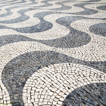 Typical portuguese cobblestone pavement pattern in Lisboa, Portugalの写真素材