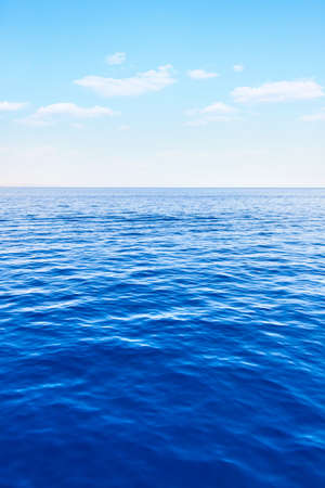 Sea and blue sky with clouds, may be used as background. Seascapeの写真素材