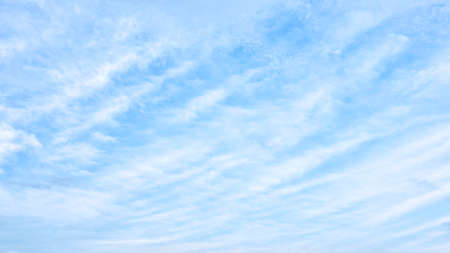 Light-blue sky with white clouds - backgroundの写真素材
