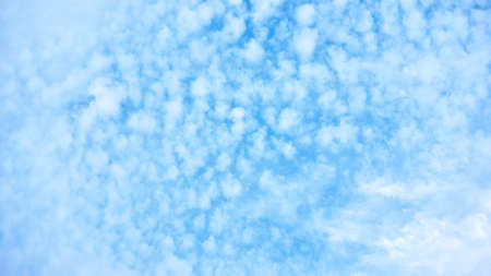 Blue sky with many small clouds -  background with copy spaceの写真素材