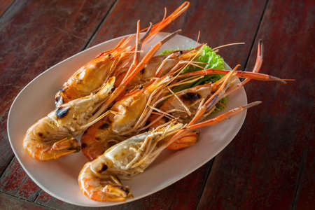 Grilled prawns on plate close-up. Asian seafoodの写真素材
