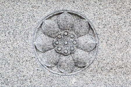 Sacred lotus close up, stone carvingの写真素材