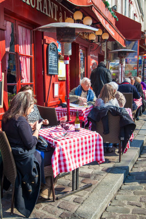 Paris, France - March 4, 2011: People at terrace of cafe in Montmartre in Parisのeditorial素材