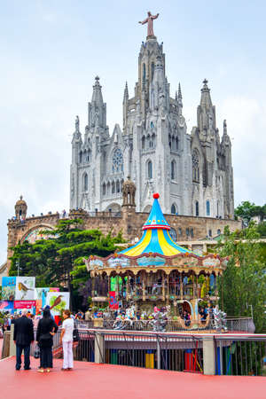 Barcelona, Spain - June 12, 2011:  Temple of the Sacred Heart of Jesus in Tibidabo and amusement park near byのeditorial素材
