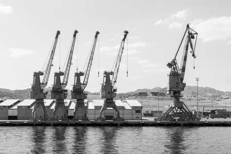 Eilat, Israel - May 22, 2009: Port cranes in cargo port in Eilat. Black and white photographyのeditorial素材