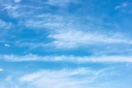 Blue sky with cloud stripes - background with copy spaceの写真素材