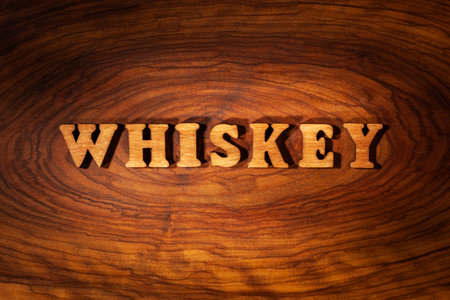 Whiskey word - Inscription by wooden letters close upの写真素材