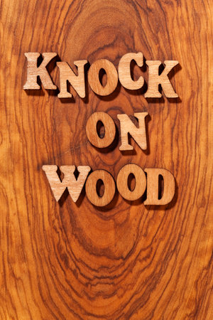 Knock On Wood phrase by wooden letters close upの写真素材