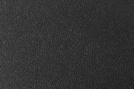 Black textured plastic surface, may be ysed as backgroundの写真素材