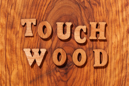 Touch Wood phrase by wooden letters close upの写真素材