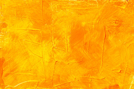 Yellow orange background with texture and stainsの写真素材