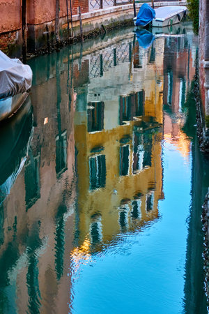 Venetian mirror - Venice city in water reflectionの写真素材