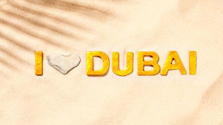 I Love Dubai - Golden letters in the sandの写真素材