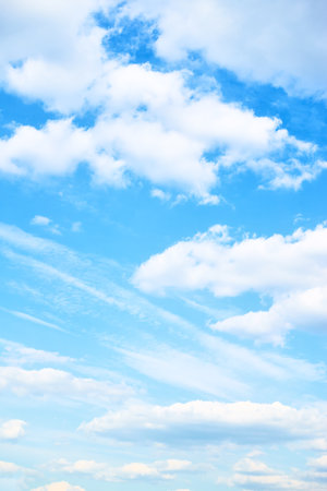 Blue sky with clouds. Vertical background with space for textの写真素材