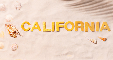 California - Text in white sand with seashells. Beach vacation conceptの写真素材