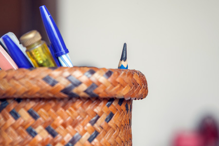 pencil and pen in texture of native thai style weave sedge matの写真素材