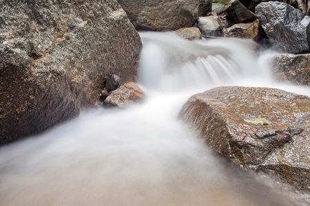 big rock on waterfallの写真素材