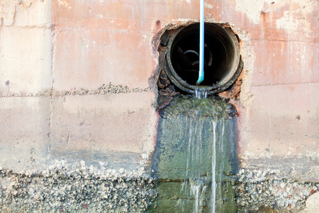 overflow water pipe Stone wall background