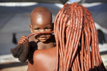 a woman from the tribe Himba with childのeditorial素材