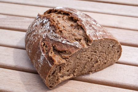 Rustic bread on an old vintage planked wood table.