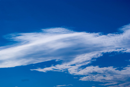 blue sky background with tiny cloudsの写真素材