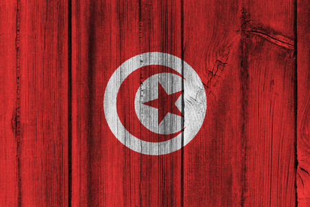 Tunisia  flag painted on wooden wall for background.の写真素材