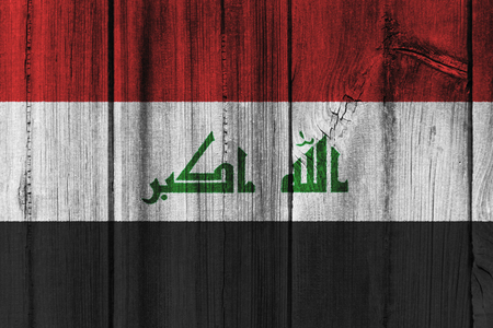 Iraq  flag painted on wooden wall for background.の写真素材