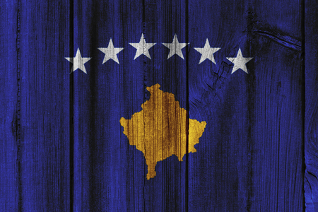 Kosovo  flag painted on wooden wall for background.の写真素材