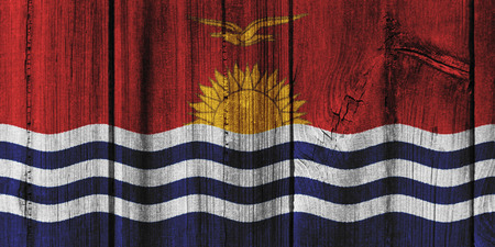 Kiribati  flag painted on wooden wall for background.の写真素材