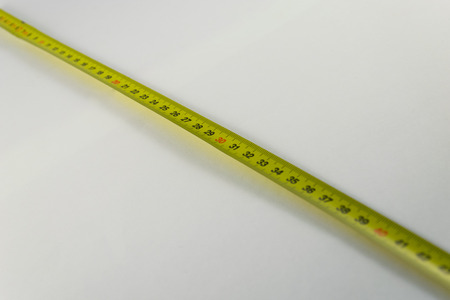 Yellow Measure Tape,  Centimeter. Measure Tool Equipment. Background.の写真素材