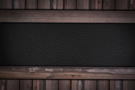 black leather texture pattern on wooden background.の写真素材