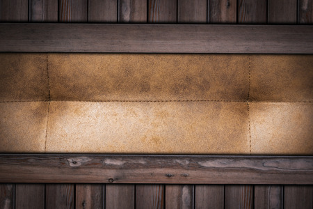 brown leather texture on wooden background .の写真素材