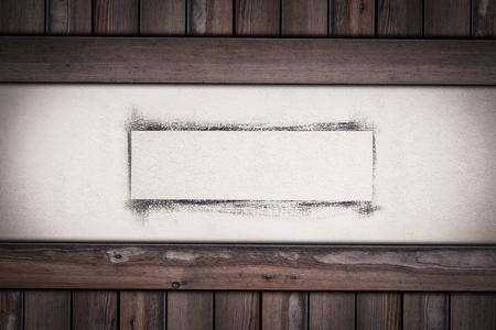 white wall with painted frame on wooden background.の写真素材