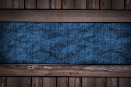 abstract blue jeans texture on wooden background.の写真素材