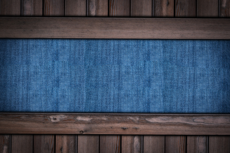 abstract blue jeans texture on wooden background.の写真素材