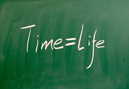 Time and life concept on blackboardの写真素材