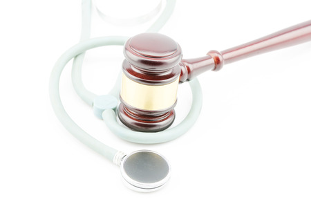 concept about medical lawsuit, stethoscope and gavel on white backgroundの写真素材