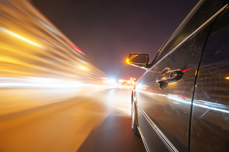 car on the road with motion blur backgroundの写真素材