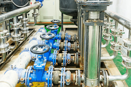 Equipment, cables and piping as found inside of industrial power plant